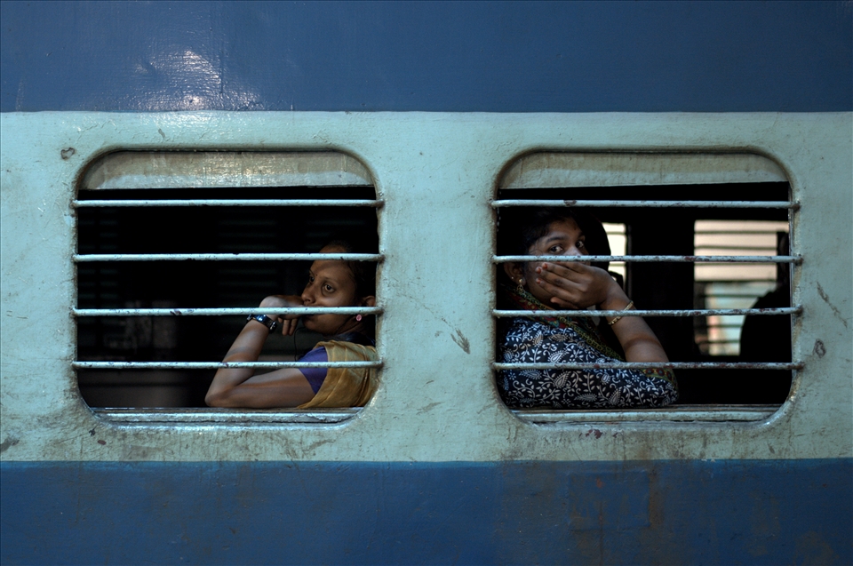 Between 2012 and 2014 I logged more than 300 hours traveling on the Indian Railways, riding in every class and sometimes sleeping near the toilets in the connector joints when I couldn’t get a ticket. This is 3am in Chennai. I stepped off the train and spotted these two women looking out of the Ladies Only compartment.