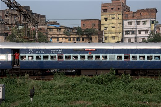 Approaching Kolkata the train traffic was backed up for miles, so we rolled into the sprawling metropolis slowly, alongside other trains. Here a man was leaning out the open berth door, waiting to jump off.