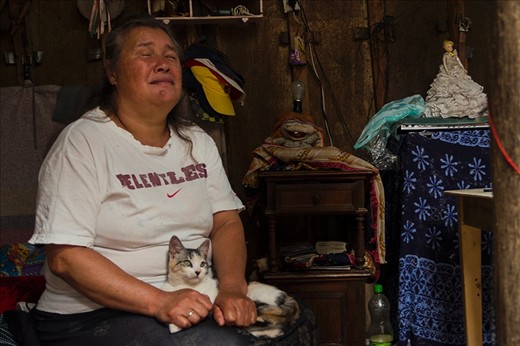 Luz Stella his wife, who is totally blind stays at home doing the chores and taking care of the cat.