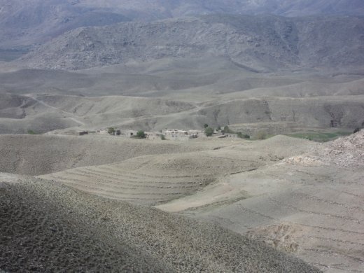 The village of Manu Kalah, surrounded by pastures and poppy fields.