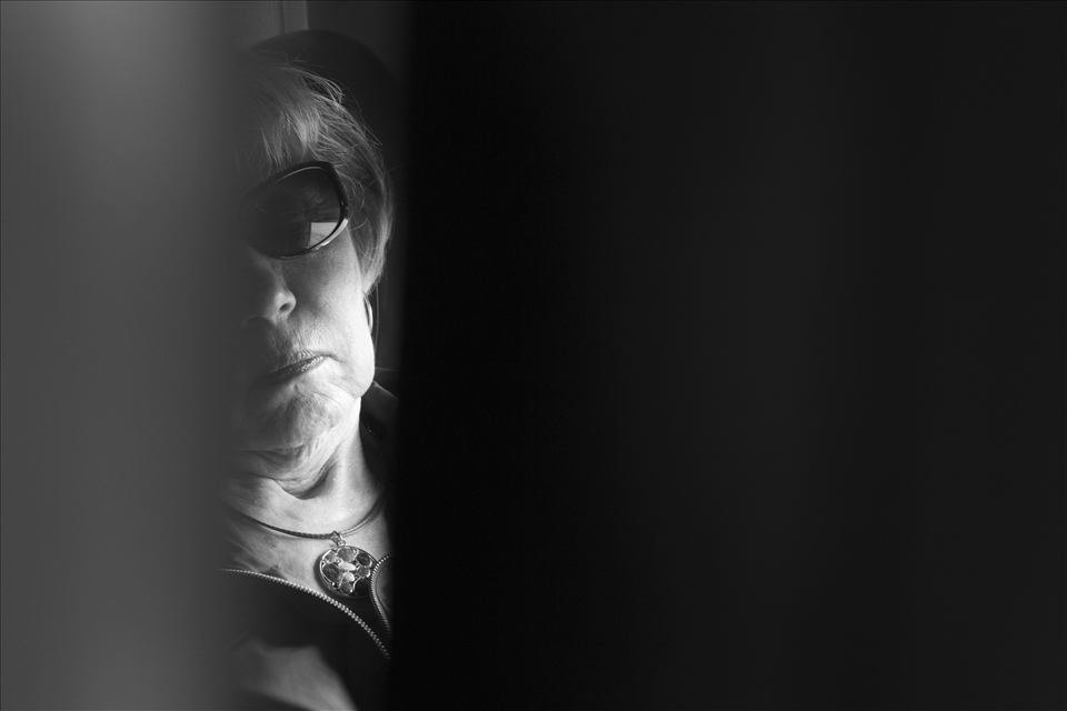 Private moments glimpsed between the seats of economy class add to the surrealism of the longhaul train ride.