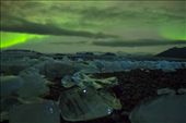 we made our way along the shore of the lagoon in pitch dark.  the aurora flickered over our heads illuminating the sky witha brilliant emerald while the the glacier ice captures reflections of starlite: by dojoman2001, Views[159]