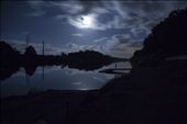 “Pioneer Silhouette” Sitting outside on a balmy North Queensland night, the full moon lit up the sky. I drove to the Pioneer River and parked on the boat ramp, opened my sunroof and put the camera on 20 second exposure.  I love the feeling of this photo.  The silhouette of the man on the pontoon, taking in the moment as the moon is embraced by thick clouds and a star twinkles on the water.: by dokart, Views[309]