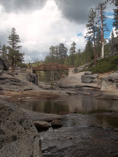 After a night at Camp 4,  I trekked to the top of the Yosemite Falls for my first hike.  It was slow and tiresome, but I kept going.  At the top a bridge crossed over the river that cascades off the cliff.  An approaching storm looms in the sky covering the scarce blue.  Shot with my Kodak Easyshare c195