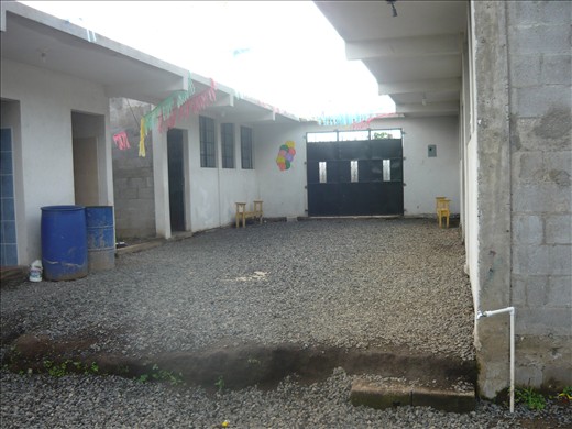 The school itself, with the classrooms and the front entrance.