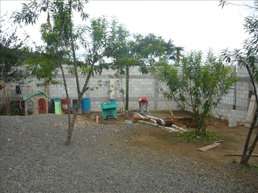 Digging trenches for the first layers of the wall.