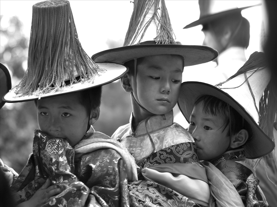 Boys jostle as they parade in line. Many others from the surrounding villages of Rebkong, in Qinghai Province (former Amdo Tibet), take part in this procession as way of penance to appease the surrounding Mountains.