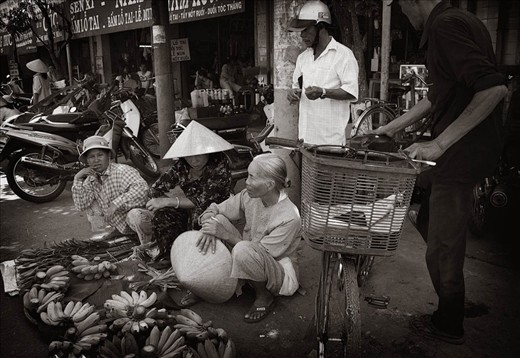 In the market place the local sellers vie for a space to sell their wares, even 