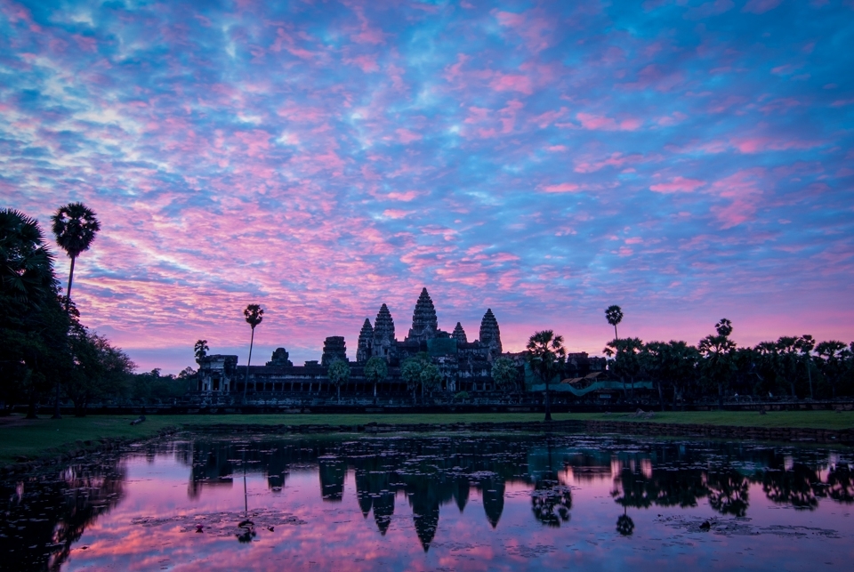 Sunrise at Angkor Wat is a time for reflection. It is a popular early morning destination for both the local Khmer people and visiting tourists. 