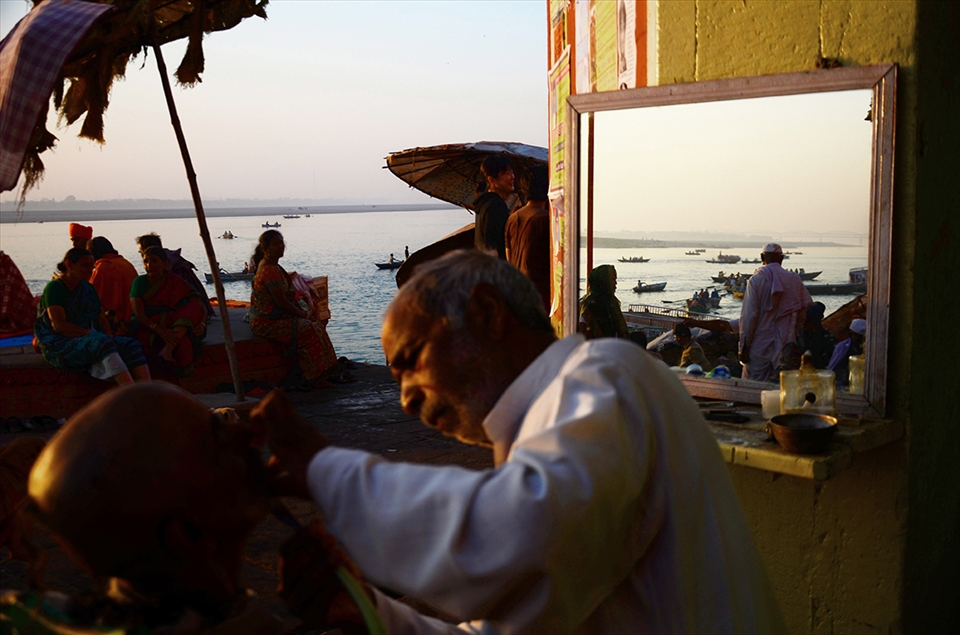 MORNING ACTIVITIES ON THE BANKS OF THE RIVER GANGES AS  ON THE RIVER ITSELF.