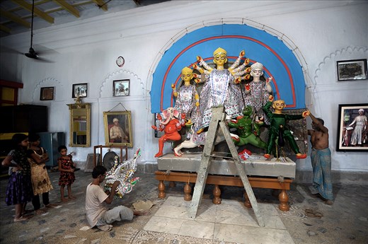 THE PROCESS OF DECORATION GOING ON. THE IDOL IN THE MIDDLE IS “GODDESS DURGA”.