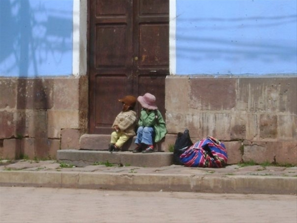 The center of the Bolivian indigenous culture,  TIWANAKU, two children, waiting for his mother, wishing her encounter ... simplicity ...