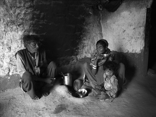 A happy family having tea and talking about their brighter future.
