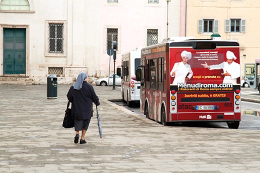 The morning of Easter Sunday 2012 in Rome stirs into life as a Nun makes her way to Vatican City for the start of the Easter celebrations