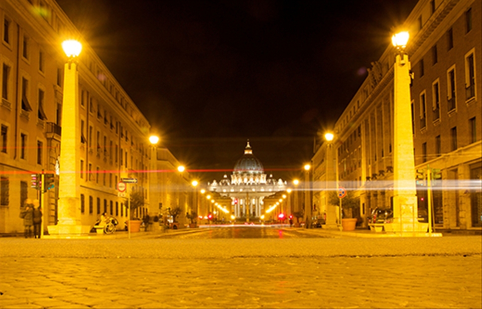 St Peter's Basilica glows in the night time air as Easter Sunday comes to a close in Rome and peace returns to it's streets.