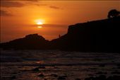 A hot summer sun rises over Fingal headland to bathe the coast in warmth. A hot summer sun rises over Fingal headland to bathe the coast in warmth.
