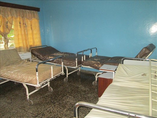 A typical ward - a small poorly ventilated room with 6 beds and up to 20 or more patients 
