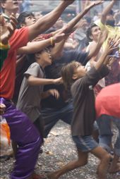 people of different ages racing and hoping catch some blessings thrown by store owners after a lion dance performance: by drichangelus, Views[158]