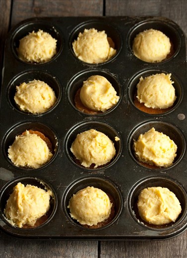 Scoop in the cake batter using an ice-cream scoop