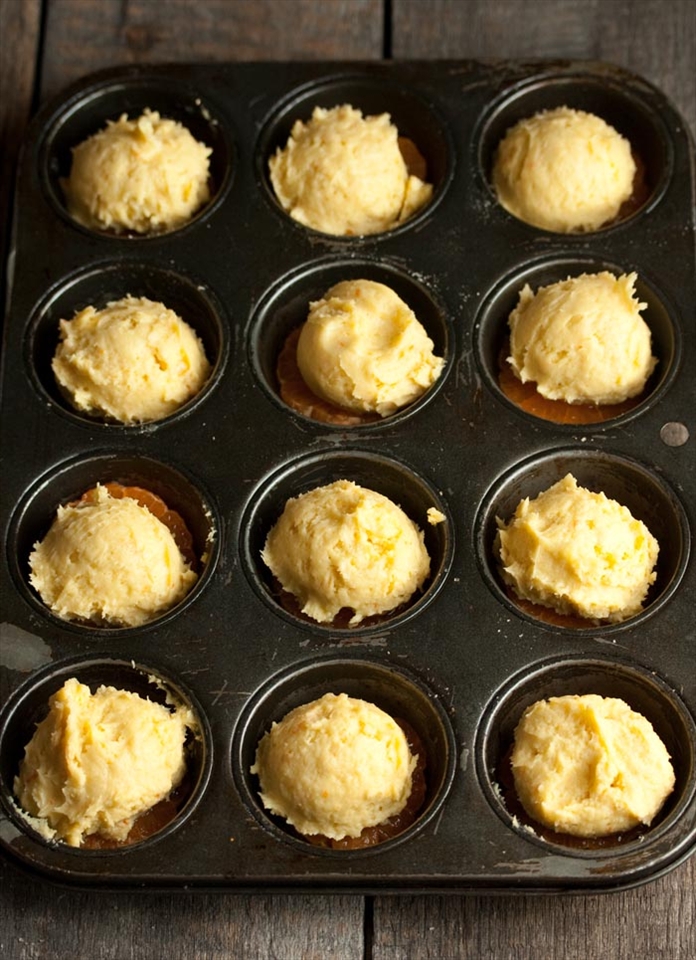 Scoop in the cake batter using an ice-cream scoop