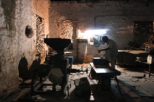 Chaos within – An elderly man in introspection after the day’s work.