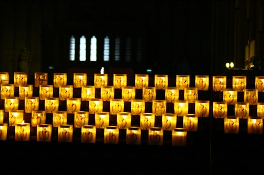 Our morning prayer: vivid passion in the fervent candles of Notre Dame.