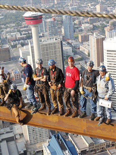 After telling the workers to act natural, I was lucky to see a Father and son hugging on the far right side who work together. The Father was holding his old lunch pale, and at the same moment the man in the red T-Shirt looking up and smiled at me when everyone alts was looking straight. It was a real moment were their personality came out.