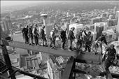 This position showed how the workers walked on and off the beam between takes, and how one man always stayed behind to clip off the safety harness of the rest before the next group. It gives the viewer more depth to take in the surrounding support structure. My favorite part is when I noticed the worker clipping men off the harness, putting his hand up for a big high five to his friend.: by dustin, Views[497]