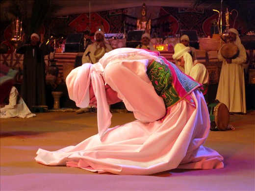 A Sufi cries during his performance representing the orbiting of planets. 