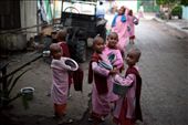 Morning alms: young novice Buddhist nuns in the pre-dawn light about to leave their monastery on their daily walk to collect alms from locals.: by dwk, Views[652]