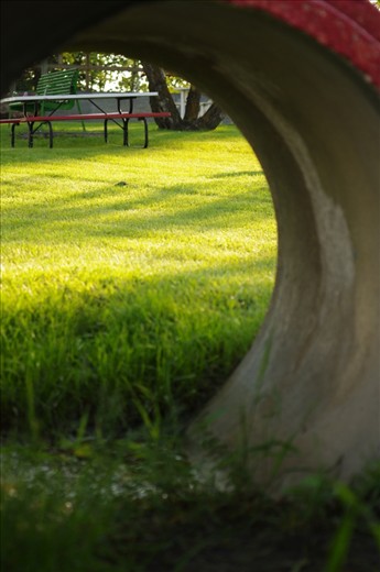 Light at the end of the tunnel.  There is hope and light beyond boundaries.  One's perception varies from another.  What is perceived as limiting has it's end at the end of a tunnel, bringing maximum possibilities.