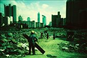 A worker and kids on a demolition site with the future to come on the horizon. Right in the heart of the cities in China you can find these huge demolition sites. Playground for some, opportunities or regrets for others. Probably none of the people on this photo will ever be able to afford to live on  what is going to be built here.
(Analog photo): by dypiem, Views[390]