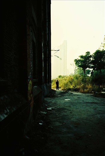 An old man contemplating an abandoned neighborhood which has been used by local youth as canvas for tags. He may have lived there in the past or like many others just wandering around. It is still unknown what will happen to this place after that the company which was supposed to renovate it went bankrupt over corruption charges.
(Analog photo)