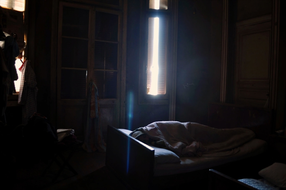 George Goda, an instructor at the Advanced Academy for Modern Computer Science, is a man living during the time of Egypt's partition of the Arabic Spring. At 27 years old, George is shy and not a very public speaker. A middle class worker, he spends most of his time in his room, and rarely opens any but one of his three windows. His room contains a large wardrobe, and two beds- one of which belongs to his late brother, who lost his life in a car accident some two years prior.