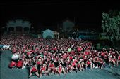 China. Henan province. Dengfeng city. Shaolin Tagou Martial Arts School. Thousands of young students watching a Sanda match on the huge lcd screen standing aside the school.: by edoardolucci, Views[971]