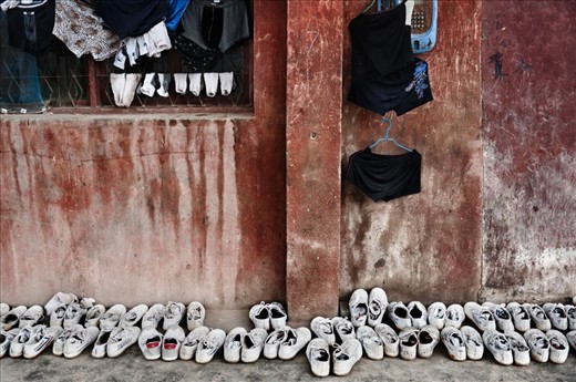 China. Henan province. Dengfeng city. Shaolin Tagou Martial Arts School. Hanging out clothes and shoes in front of a student dormitory.

