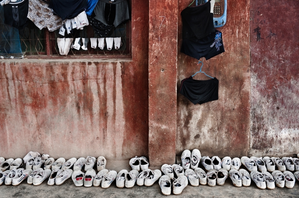 China. Henan province. Dengfeng city. Shaolin Tagou Martial Arts School. Hanging out clothes and shoes in front of a student dormitory.

