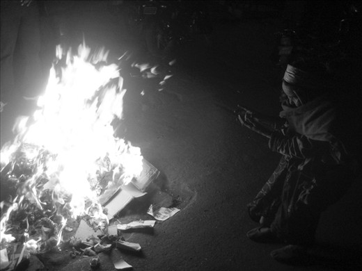 As the protests abated, we were able to explore the city. Here a homeless woman takes refuge from the frosty Kathmandu winter’s night. Swaddled in rags, the flames illuminate her face as she worships the warmth.