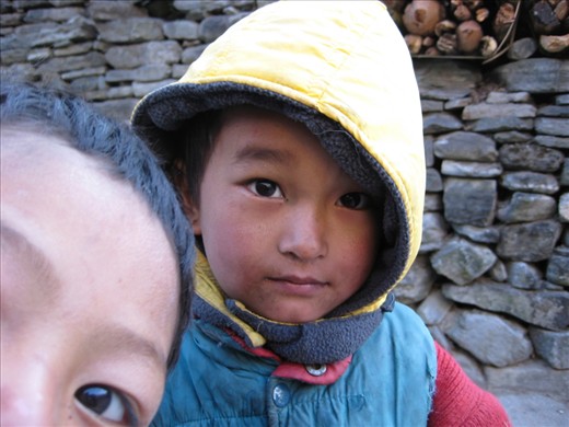 I encountered two Nepalese children on a remote mountain pass. Unencumbered by the pressures of the city, they were at ease in the presence of strangers. The engaging stare of the boy in the brightly coloured hood was surprisingly interrupted by the unabashed curiosity of his friend. 