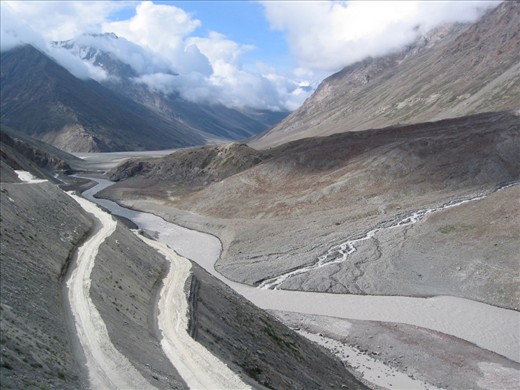 the highway winds and folds multiple times on the slope of the valley