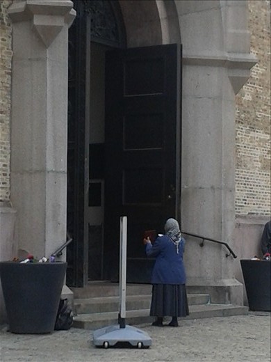 A women begging outside a church, Oslo