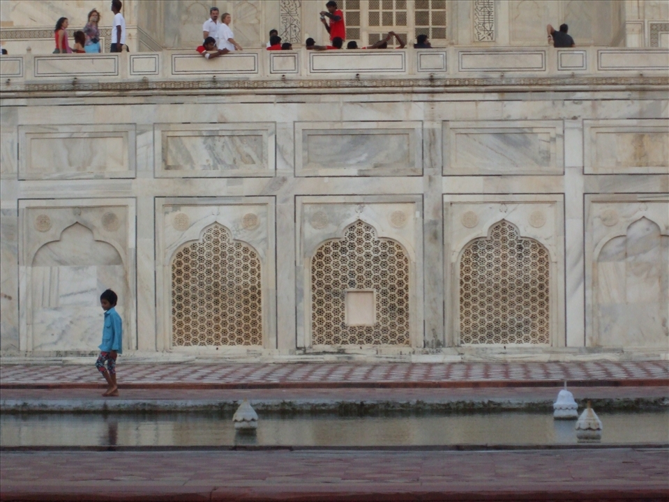 Standing out - carefree, happy and adventurous Indian boy at the Taj 