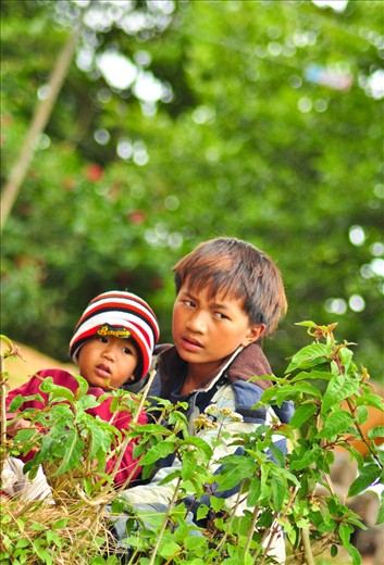 The other jeep was stuck again with the unpaved muddy road, so we had a stop-over somewhere and noticed some local kids playing and watching the numerous jeeps passing by their place.