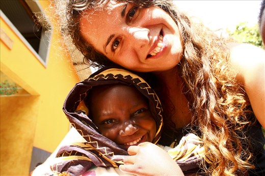 Me and Pendo, one of the babies who tried my cake in Kijiwetanga village, Kenya