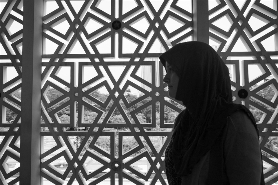 Regardless of religious background, every female who enters the National Mosque must be totally covered except for her hands, feet, and face. 