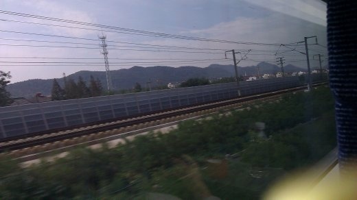 The parallel track and beginning of the mountains.