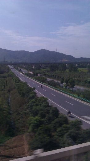 The highway paralleling the railway and the mountains