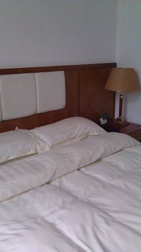 My Bei Hai Hotel bed -  There was no heat.  I slept under two duvets!  The hotel provided a down jacket for each guest.