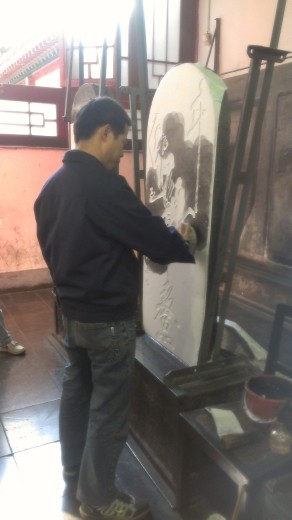 The process of creating the stone rubbings - applying the ink