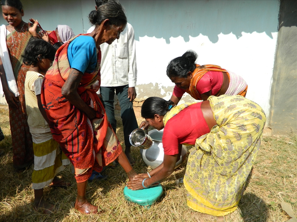 Feet wash, a tradition to wash the Feet of  Guest. from boy side